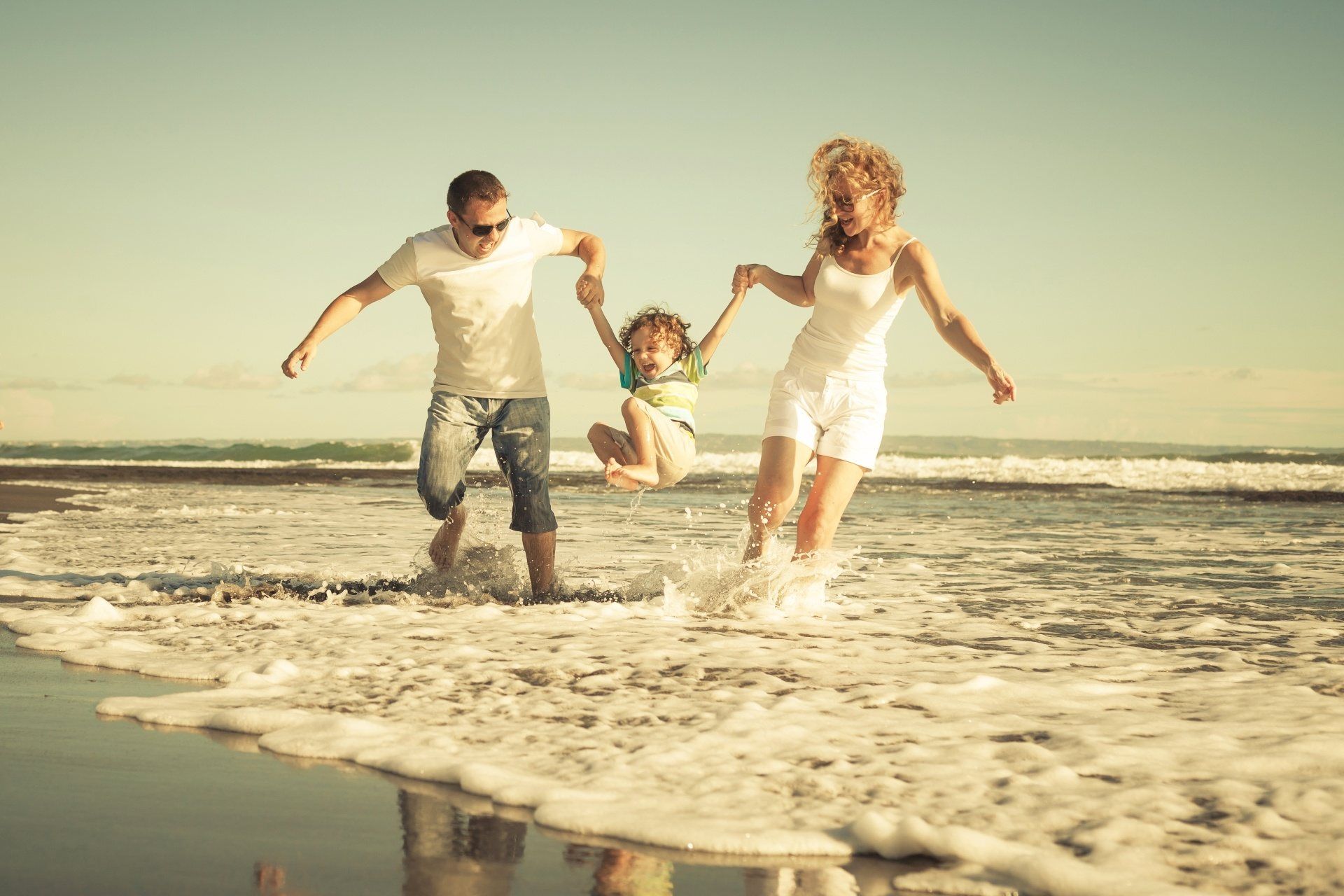 family time at beach with Resort Vacation International